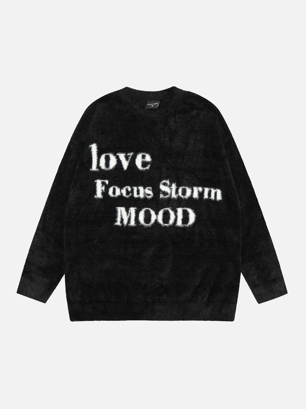 Front view of a black round neck sweater by TALISHKO, featuring bold white lettering for a casual vibe.