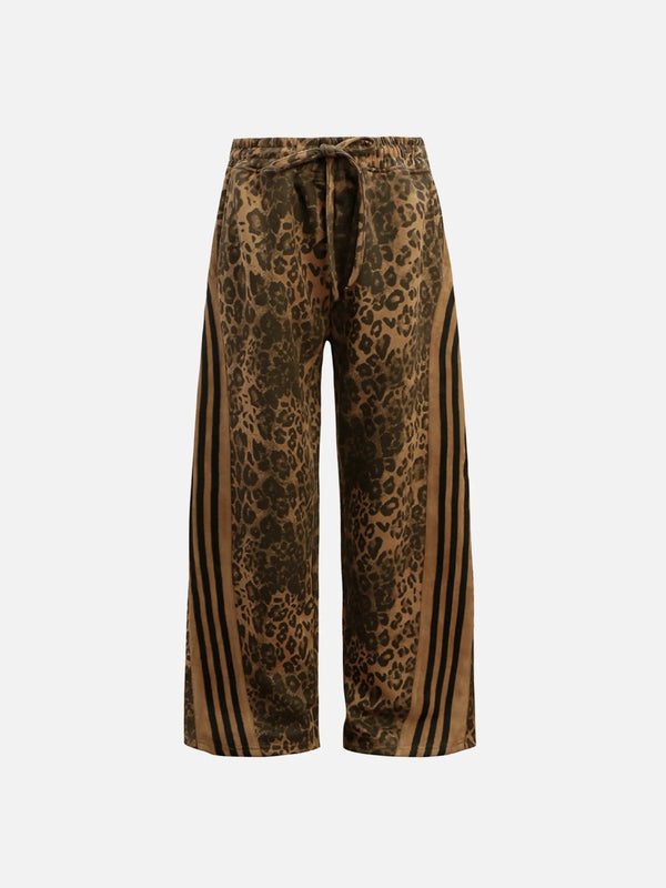 Front view of TALISHKO brown leopard stripe sweatpants, perfect for bold street style.