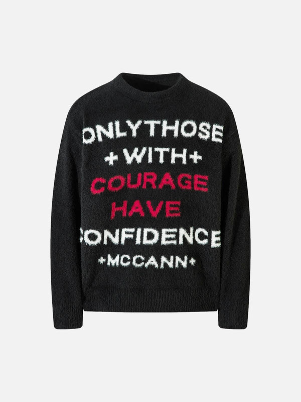Front view of a black letter graphic sweater by TALISHKO, showcasing bold, contrasting text.