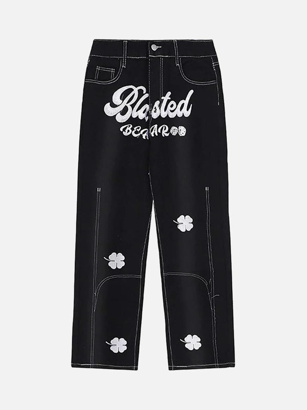Front view of black baggy jeans with lucky clover embroidery by TALISHKO, perfect for casual wear.