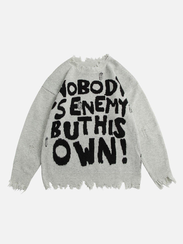 Front view of apricot ripped hole sweater by TALISHKO with bold black lettering design.