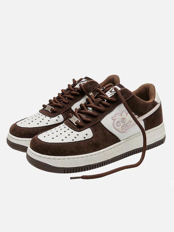 Front view of brown TALISHKO skate sneakers with playful design, perfect for casual wear.