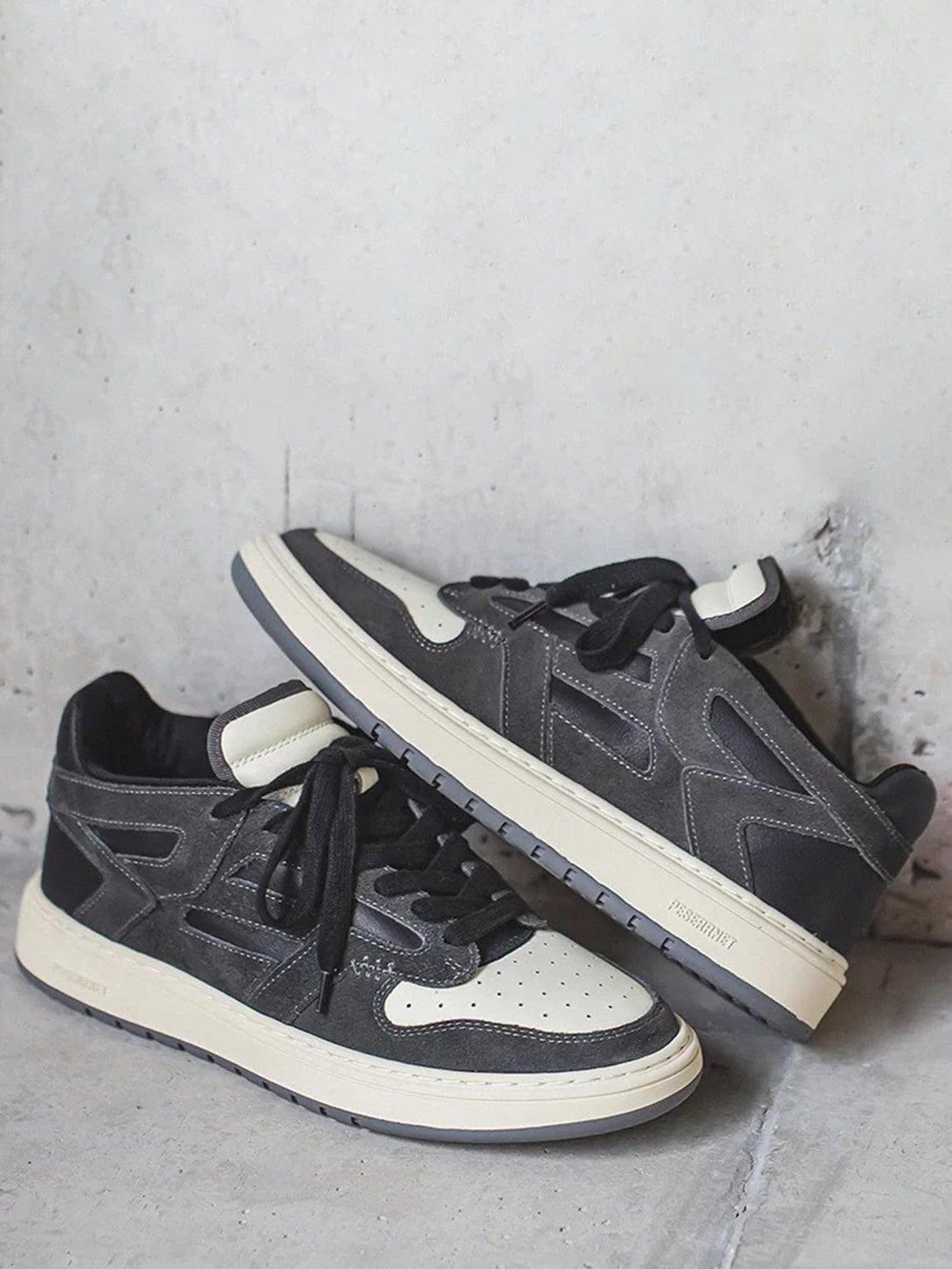 TALISHKO low-top sneakers in gray, showcasing a stylish front view with breathable design.