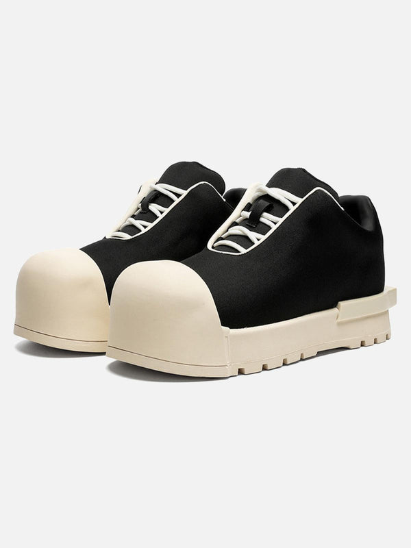 TALISHKO black low top canvas platform sneakers with a unique chunky sole design.