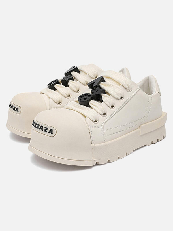 Front view of white monochrome chunky tread sneakers by TALISHKO, featuring bold laces.