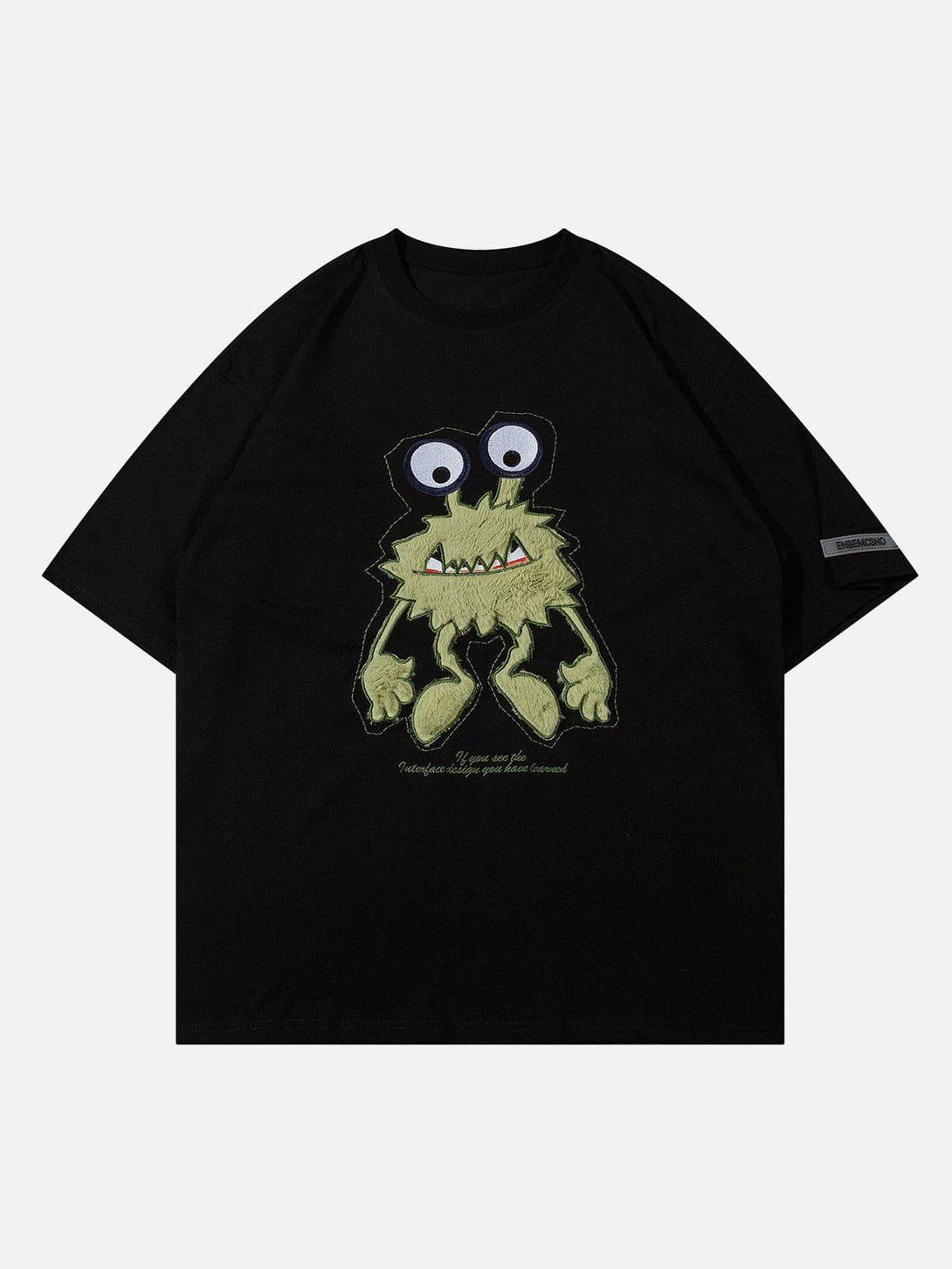 Front view of black tee featuring a quirky monster embroidery, crafted by TALISHKO.