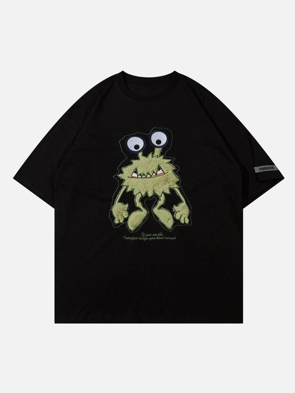 Front view of black tee featuring a quirky monster embroidery, crafted by TALISHKO.