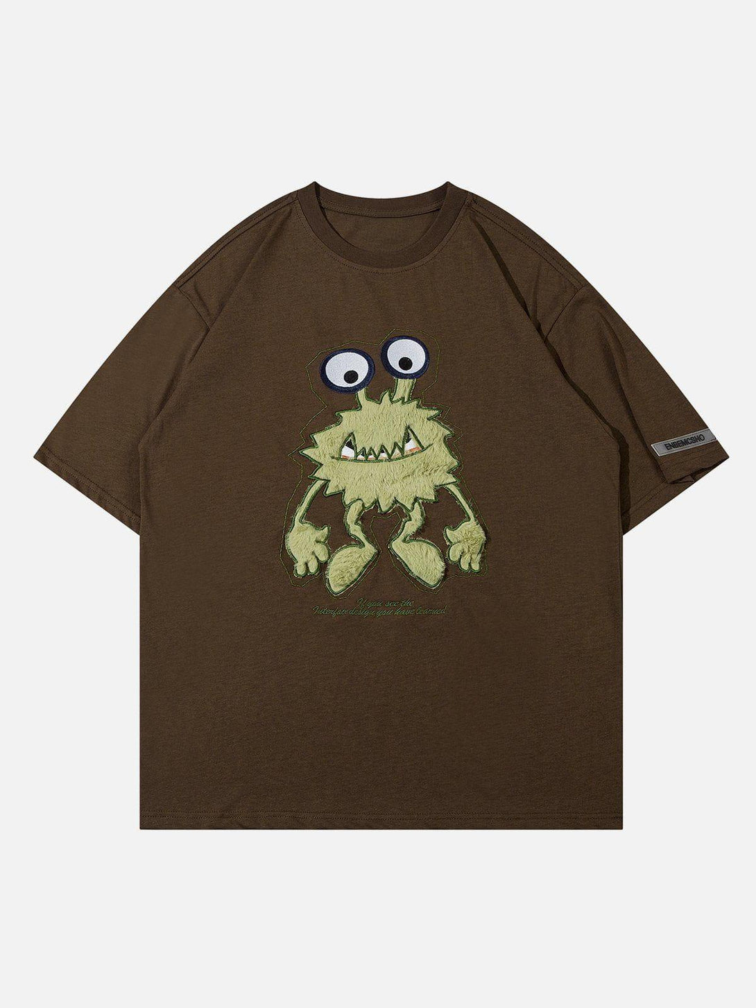 Front view of coffee tee featuring quirky monster embroidery, crafted by TALISHKO.