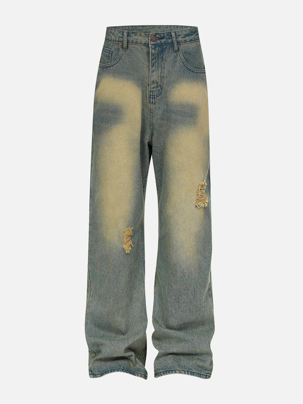 Front view of blue mud-dyed loose jeans by TALISHKO, featuring a distressed design.