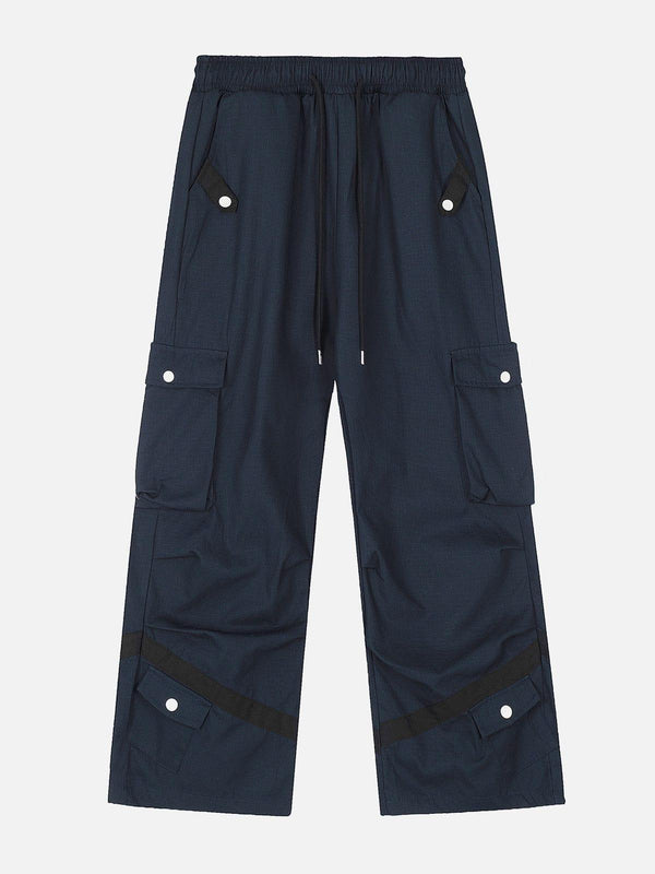 Front view of blue cargo pants with multiple pockets, by TALISHKO, perfect for urban style.