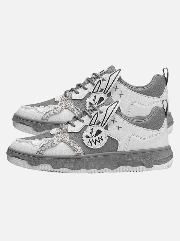 Side view of stylish gray board shoes by TALISHKO with unique graphic design accents.