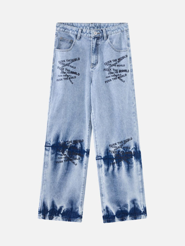 Front view of TALISHKO blue tie-dye jeans with unique letter embroidery, showcasing edgy style.