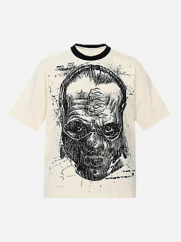 Front view of apricot graphic T-shirt by TALISHKO, featuring a bold, artistic face design.