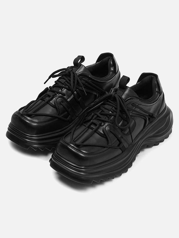 Sleek black outdoor platform sneakers by TALISHKO, front view highlighting bold design.