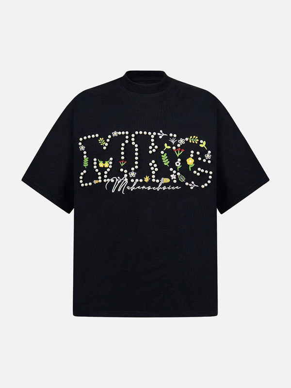 Front view of a black oversized t-shirt with floral embroidery by TALISHKO, perfect for warm days.
