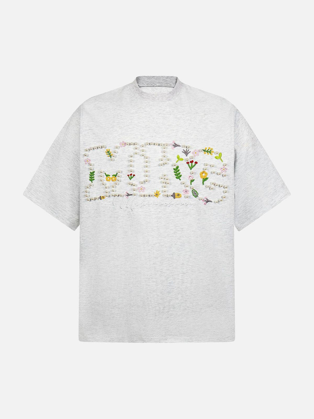 Front view of a white oversized t-shirt with floral embroidery by TALISHKO, ideal for sunny days.
