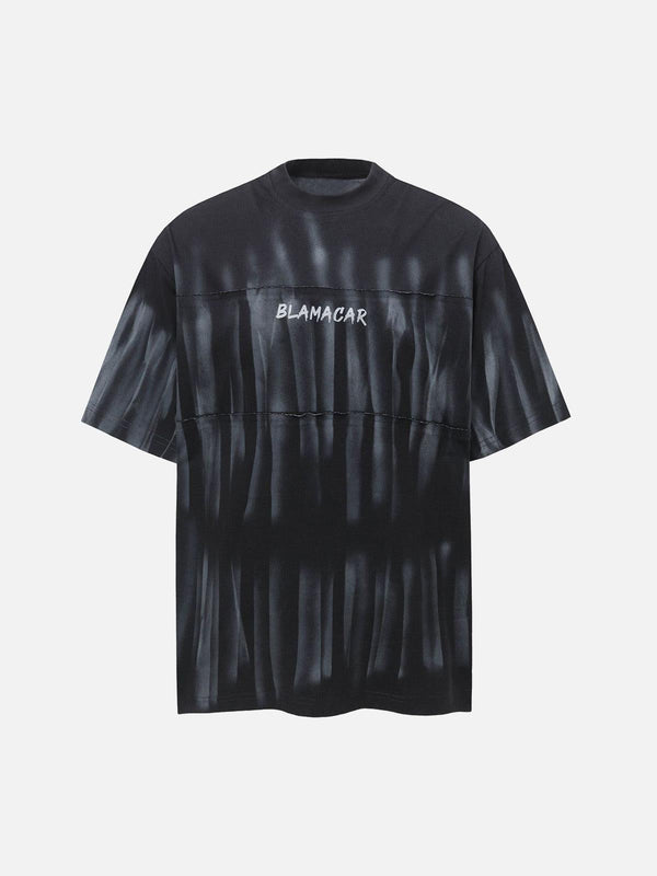 Front view of a black oversized tie-dye T-shirt with embroidered lettering by TALISHKO.