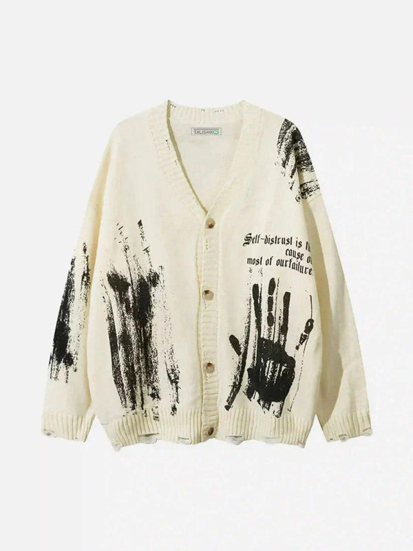 Apricot cardigan with graffiti design and a bold handprint by TALISHKO, front view.