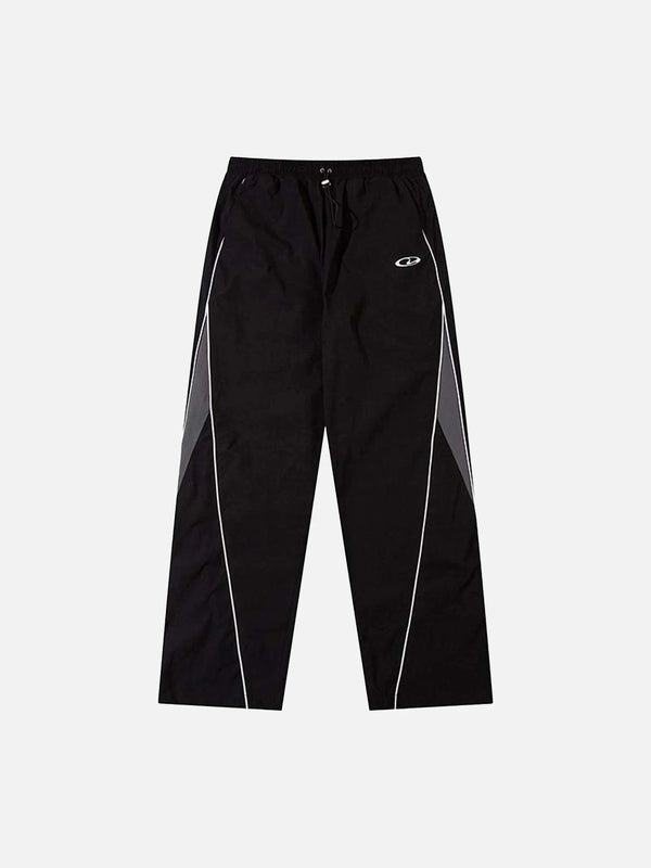 Black panelled contrast sweatpants by TALISHKO, front view showcasing sleek style.