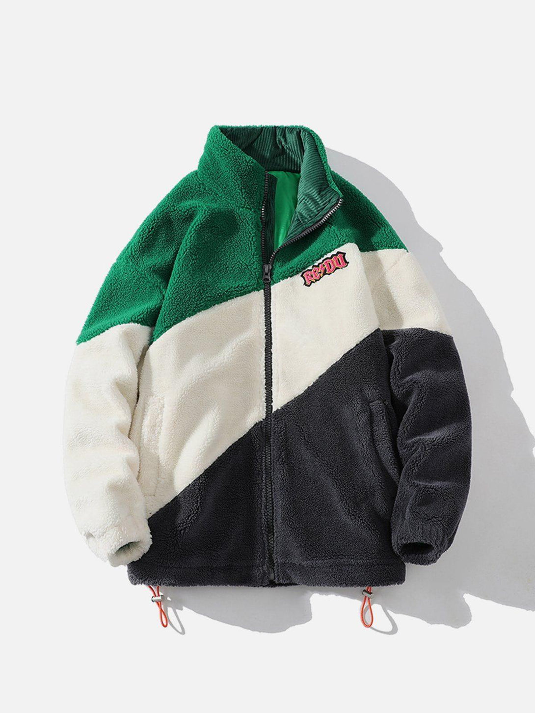 Front view of TALISHKO's green patchwork sherpa coat, featuring a bold color block design.