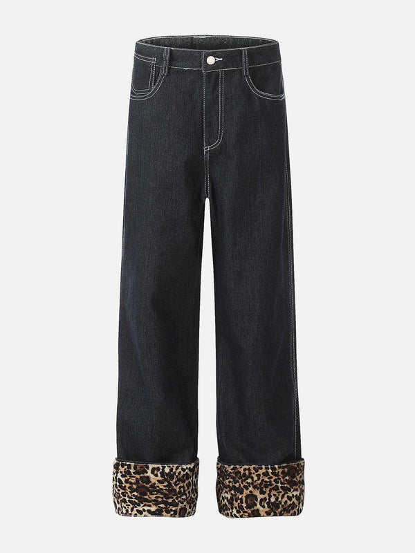 Front view of TALISHKO black jeans with leopard print cuffs, perfect for bold street style.