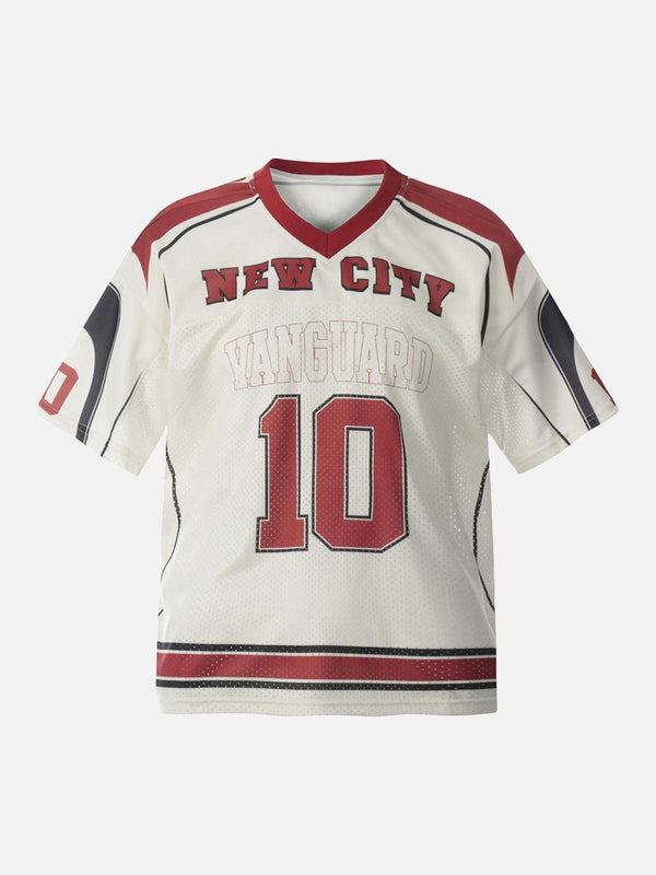 Front view of the apricot patchwork mesh jersey T-shirt by TALISHKO, featuring bold lettering.