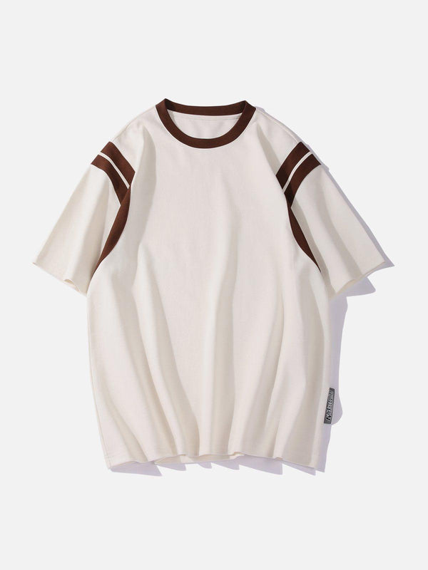 Front view of an apricot patchwork stripe tee by TALISHKO, featuring brown accents.