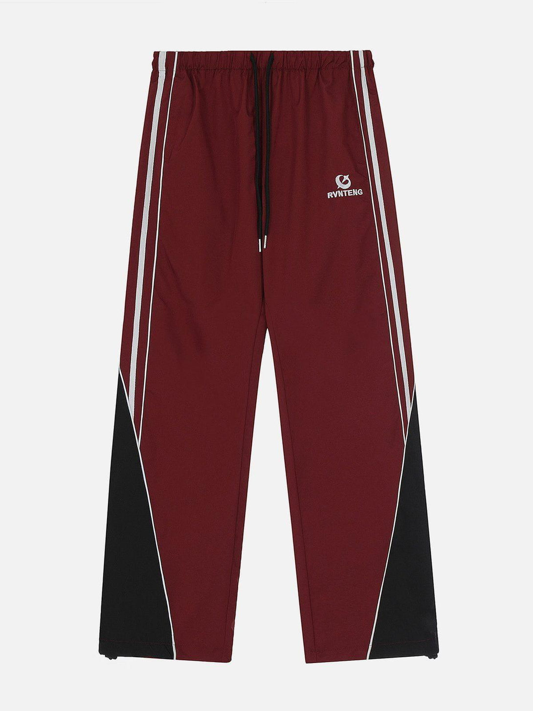 Front view of red patchwork tapered sweatpants by TALISHKO, featuring sporty white stripes.