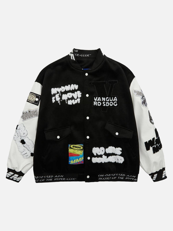 Front view of a black varsity jacket by TALISHKO with bold patches and hip hop flair.