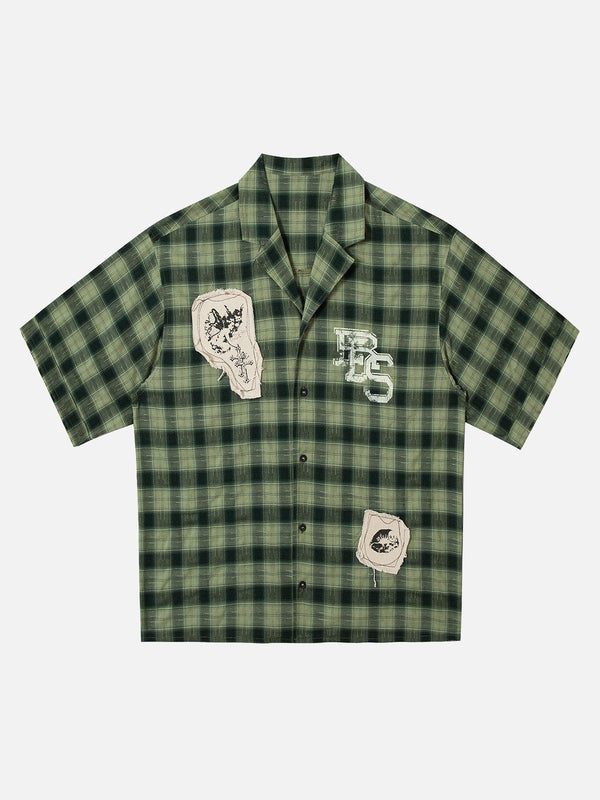 Green plaid short sleeve shirt with appliques by TALISHKO, front view showcasing unique style.