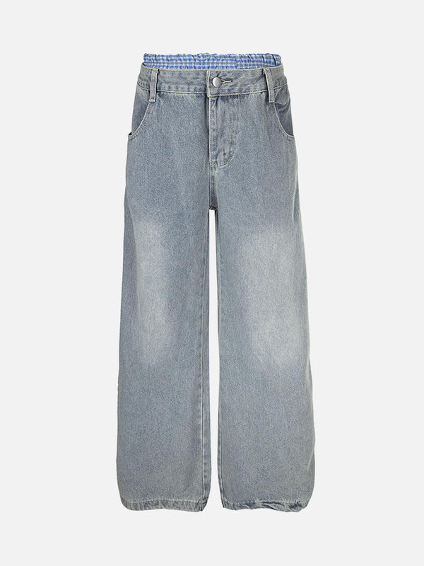 Front view of blue baggy jeans with plaid double waist detail by TALISHKO.