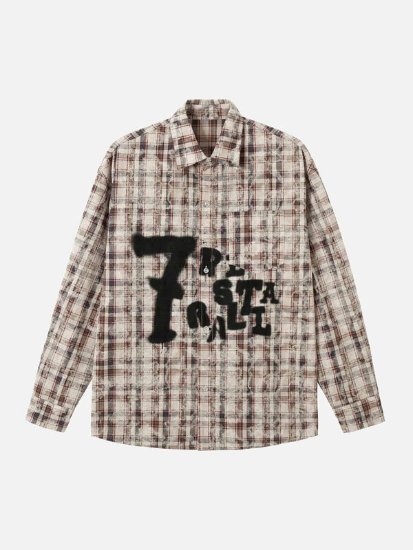 Plaid long sleeve shirt featuring graffiti-style print by TALISHKO in a front view.