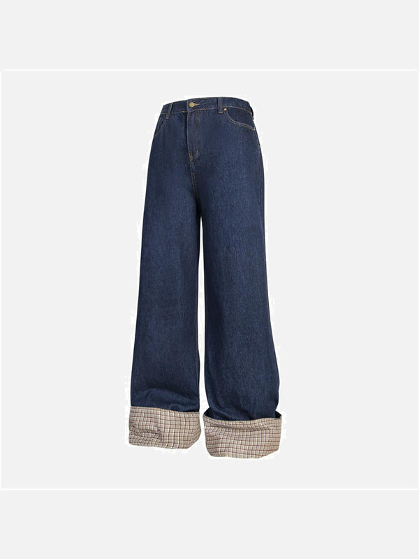 TALISHKO blue jeans with plaid cuffs, showcasing a relaxed streetwear vibe.