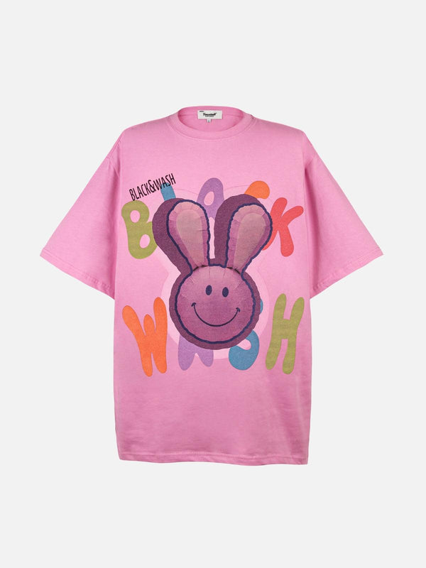 Playful pink tee by TALISHKO, featuring a colorful bunny pop art design, shown from the front.