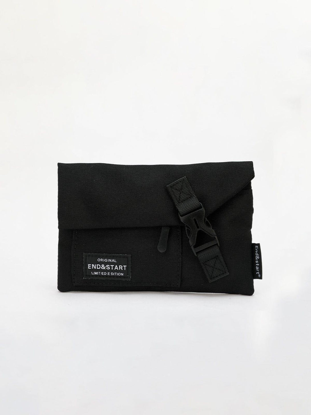 Front view of a black portable mini crossbody bag by TALISHKO with buckle detail.