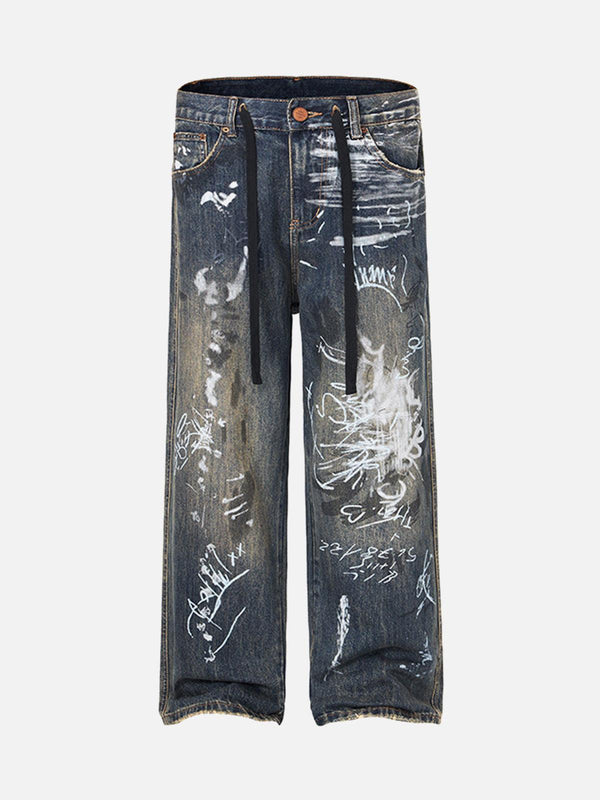 Front view of blue baggy jeans by TALISHKO, featuring unique hand-painted graffiti designs.