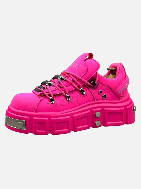 Bold pink derby shoes with chunky soles and rivet details by TALISHKO, showcasing edgy style.