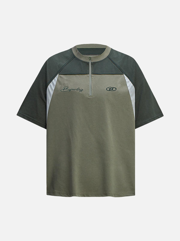 Front view of a green quarter zip-up T-shirt by TALISHKO, featuring contrast color details.