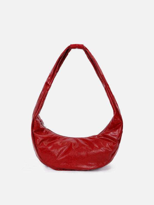 Front view of a red faux leather diagonal bag by TALISHKO, perfect for urban style.
