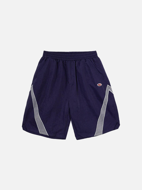 Navy blue training shorts by TALISHKO with reflective stripes, shown in a front view.