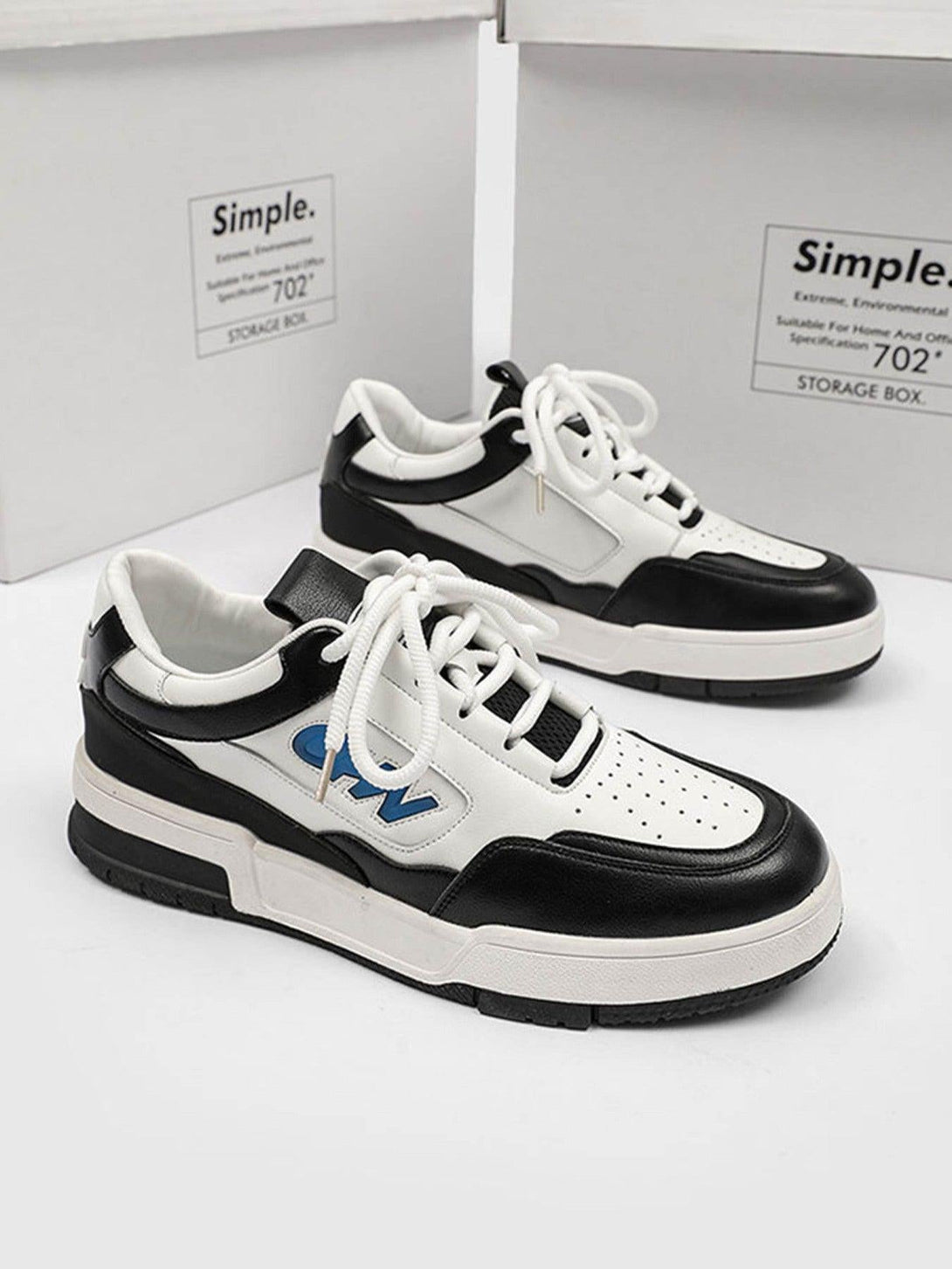 TALISHKO retro sneakers in black and white, front view showcasing a bold urban design.