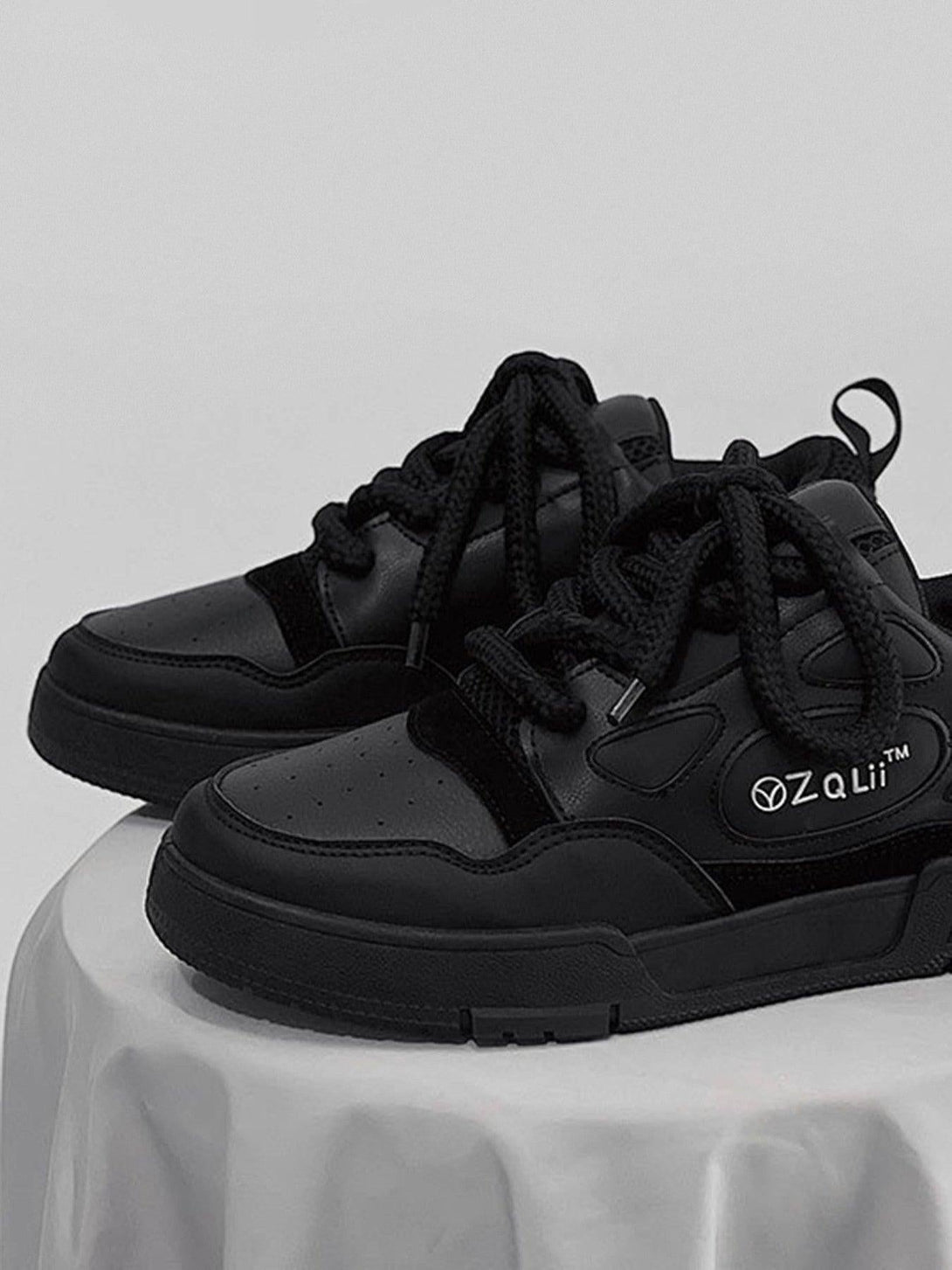 Front view of black retro casual board shoes by TALISHKO, featuring sleek design and sturdy laces.