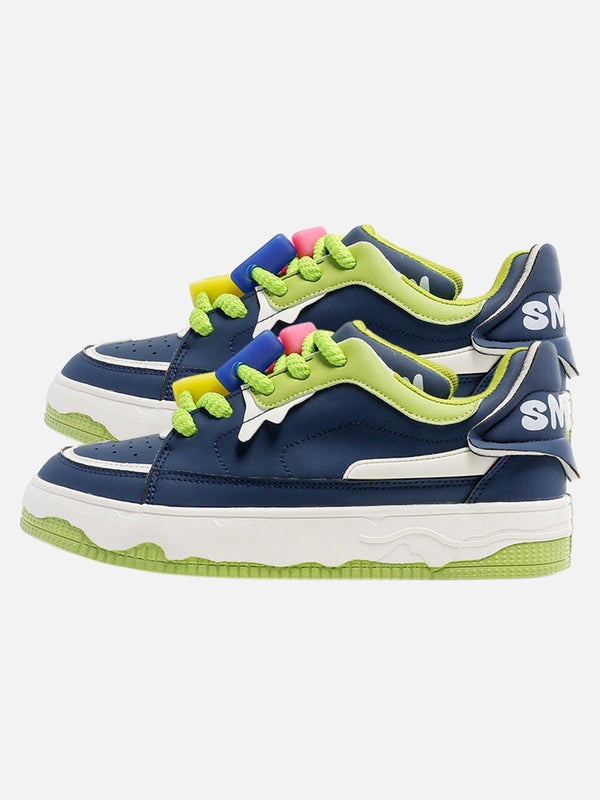 Retro casual sneakers by TALISHKO in navy and green with vibrant accents, side view.