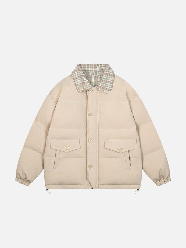 Front view of an apricot Retro Duo Coat by TALISHKO, featuring a plaid collar and pocket details.