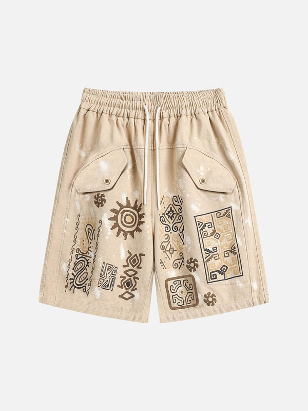 Front view of light brown hip-hop shorts by TALISHKO, adorned with retro hieroglyphic patterns.