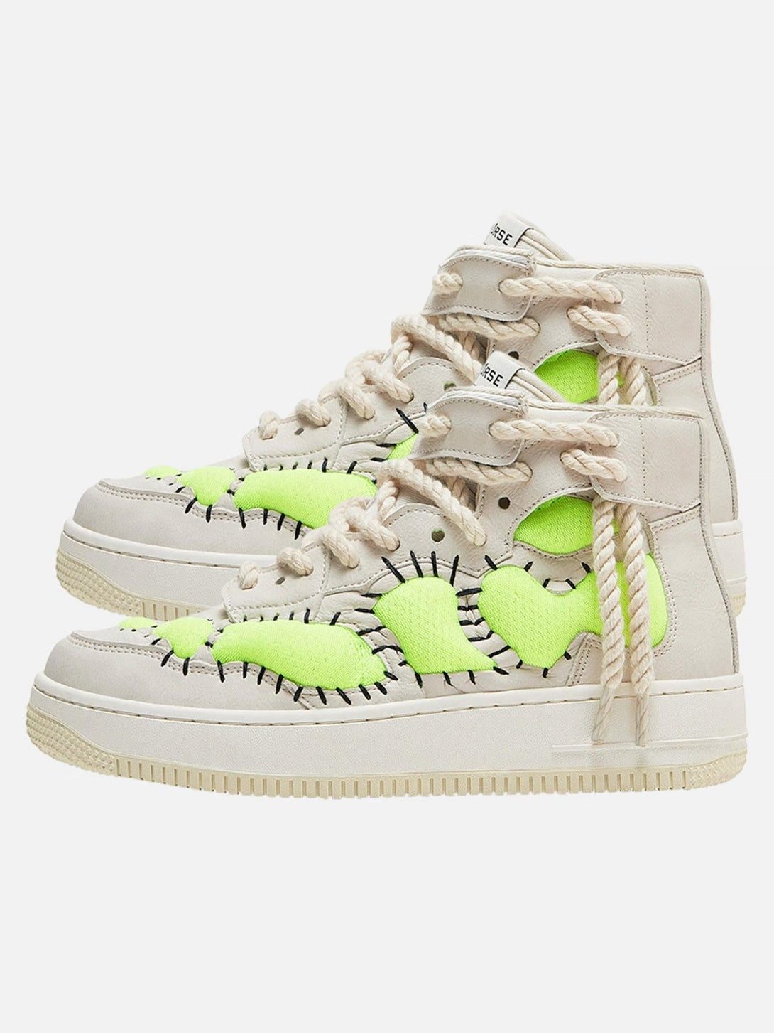 Beige high-top sneakers by TALISHKO with neon green accents and bold stitching detail.