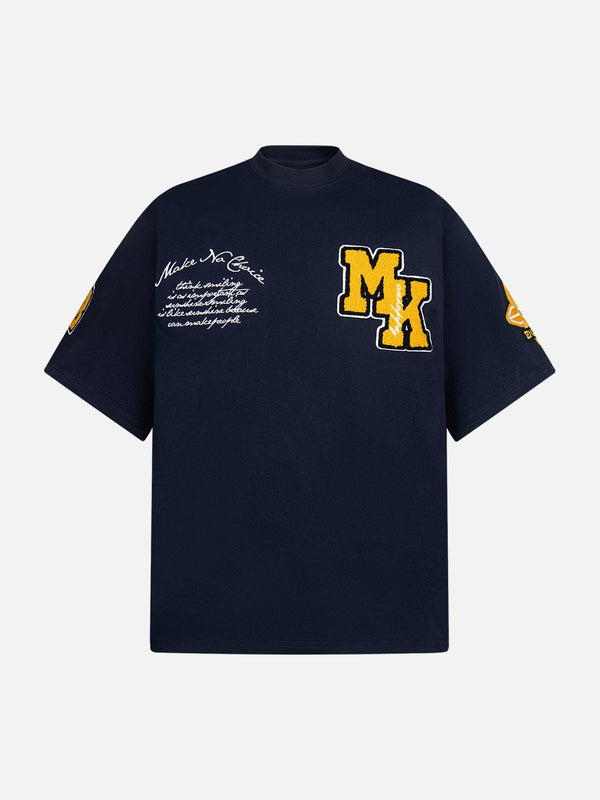 Navy embroidered T-shirt by TALISHKO, featuring retro motorcycle patches, front view.