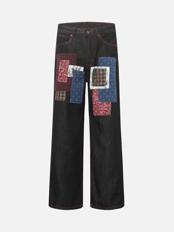 Front view of black retro patchwork baggy jeans by TALISHKO, featuring colorful patchwork.