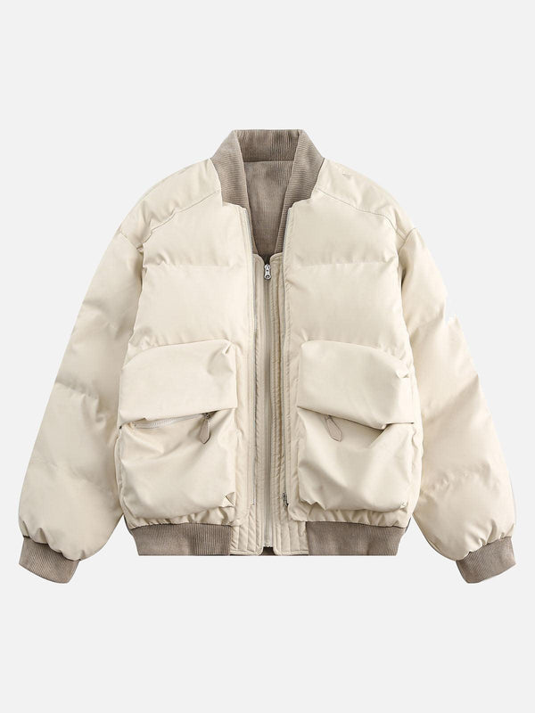 Front view of a beige puffer bomber jacket by TALISHKO, featuring a retro patchwork design with multiple pockets.
