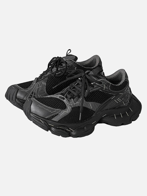 Black chunky sneakers by TALISHKO, showcasing a retro design and front view style.